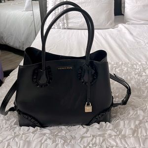 Michel Kors black handbag with cute ruffles.